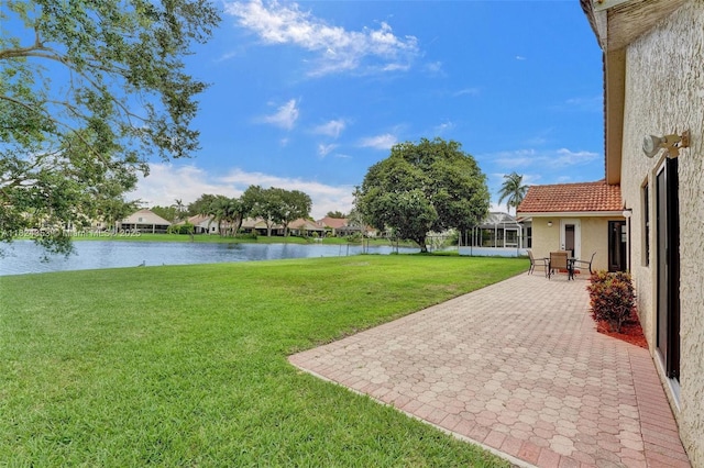 3128 Peachtree Cir, Davie, FL 33328 - view of grassy yard featuring a water view and a patio area