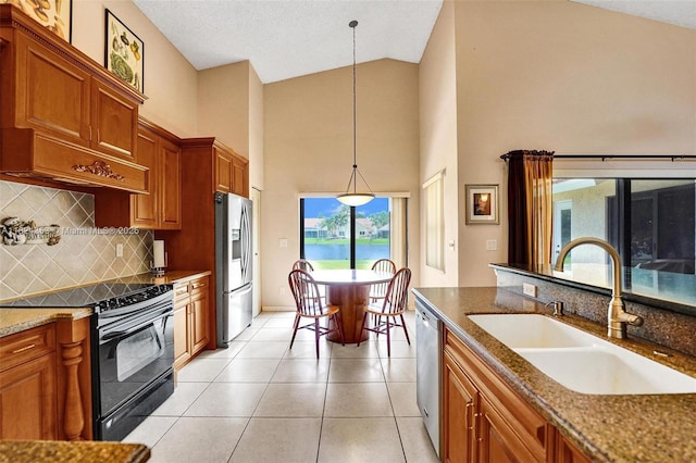 3128 Peachtree Cir, Davie, FL 33328 - kitchen featuring black electric range, stainless steel refrigerator with ice dispenser, high vaulted ceiling, dishwashing machine, and brown cabinetry