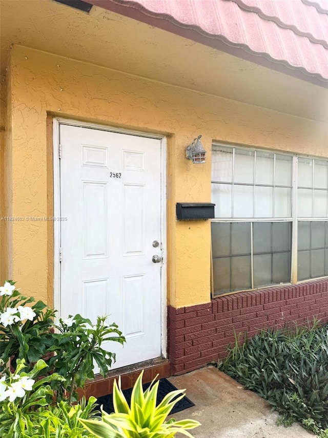 2562 NW 52nd Ave Unit B18, Lauderhill, FL 33313 - property entrance with stucco siding