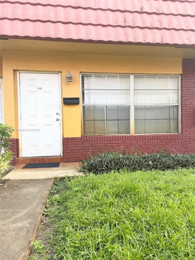 2562 NW 52nd Ave Unit B18, Lauderhill, FL 33313 - entrance to property featuring brick siding and stucco siding