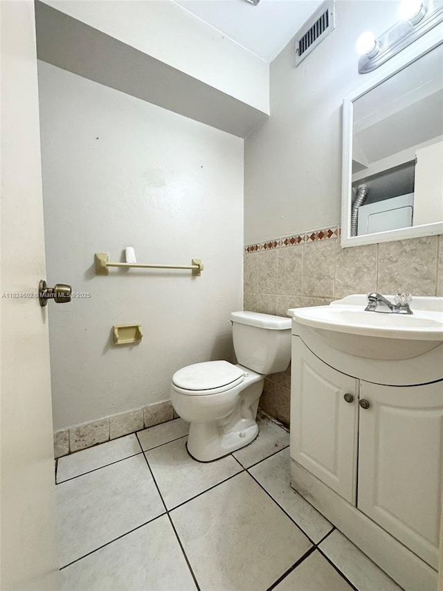 2562 NW 52nd Ave Unit B18, Lauderhill, FL 33313 - bathroom with vanity, tile patterned floors, and a wainscoted wall