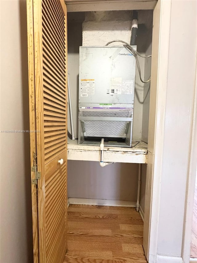 2562 NW 52nd Ave Unit B18, Lauderhill, FL 33313 - detailed view of wood finished floors, an office area, and heating unit