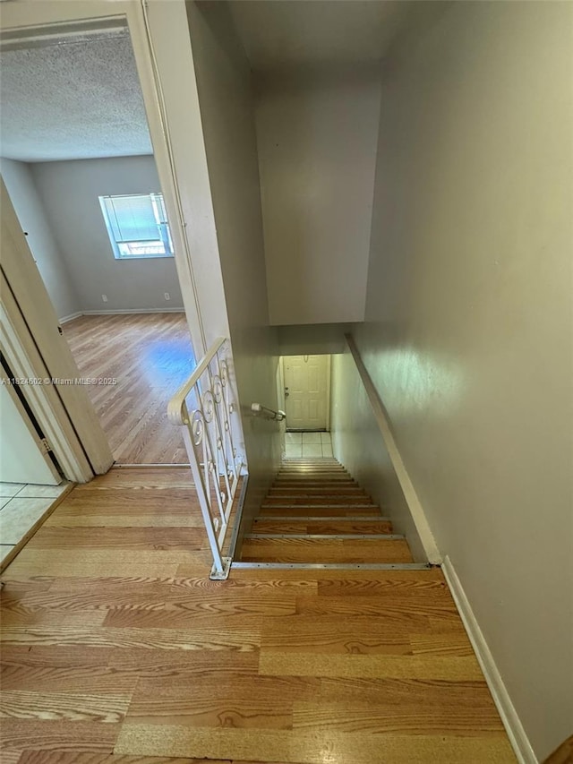 2562 NW 52nd Ave Unit B18, Lauderhill, FL 33313 - stairway with wood finished floors and baseboards