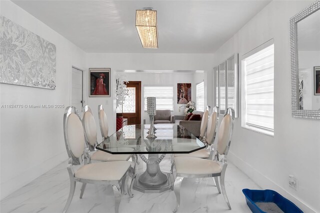 31 SW 58th Ct, Miami, FL 33144 - dining area featuring marble finish flooring and plenty of natural light