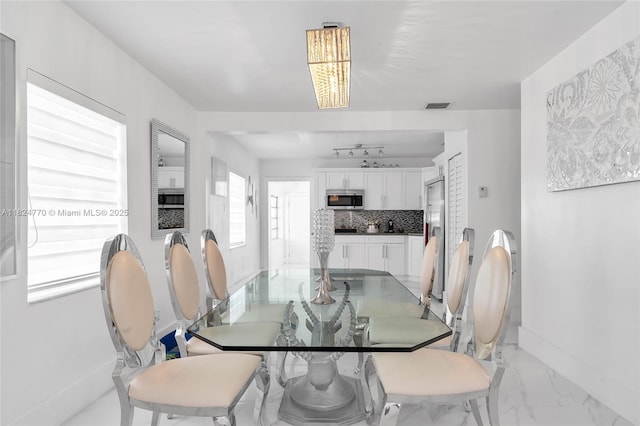 31 SW 58th Ct, Miami, FL 33144 - dining space featuring baseboards and light marble finish floors