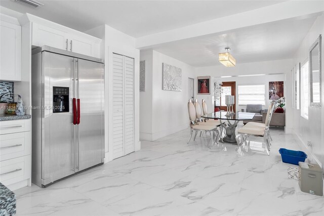 31 SW 58th Ct, Miami, FL 33144 - dining space with baseboards and light marble finish floors
