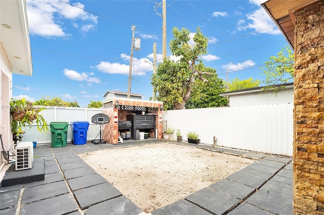 31 SW 58th Ct, Miami, FL 33144 - fenced backyard featuring a patio
