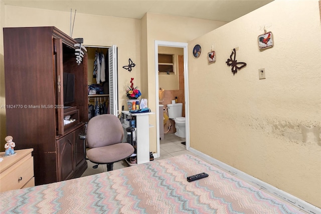 31 SW 58th Ct, Miami, FL 33144 - bedroom with light tile patterned floors and ensuite bathroom