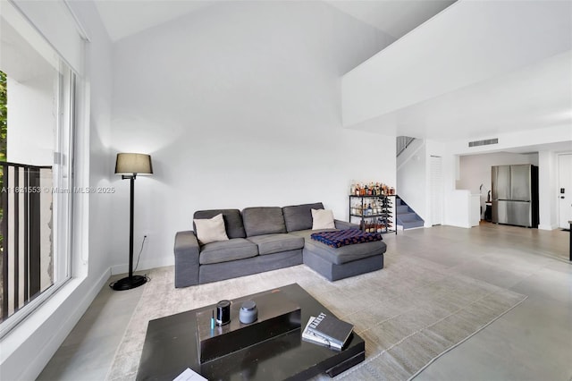 6900 N Kendall Dr Unit A303, Pinecrest, FL 33156 - living room with stairway, concrete flooring, and lofted ceiling