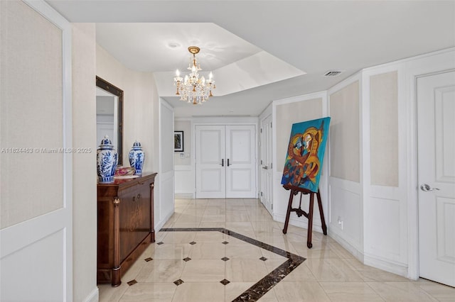 2800 Island Blvd Unit 1505, Aventura, FL 33160 - foyer entrance featuring a chandelier and inlaid floor details