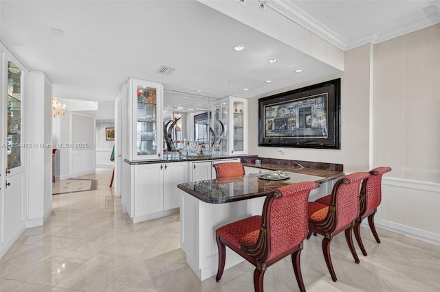 2800 Island Blvd Unit 1505, Aventura, FL 33160 - bar area with crown molding, light marble finish flooring, and recessed lighting