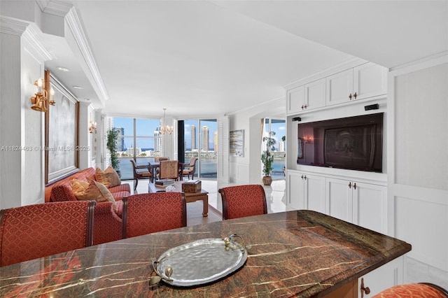 2800 Island Blvd Unit 1505, Aventura, FL 33160 - dining area with ornamental molding, a chandelier, and a wall of windows