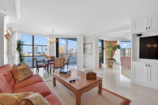2800 Island Blvd Unit 1505, Aventura, FL 33160 - living room featuring a chandelier, crown molding, plenty of natural light, arched walkways, and a decorative wall