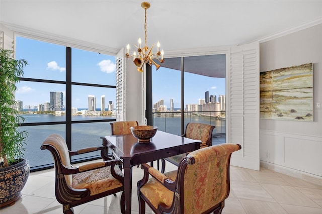 2800 Island Blvd Unit 1505, Aventura, FL 33160 - dining room featuring a skyline view, a wall of windows, a chandelier, ornamental molding, and a water view