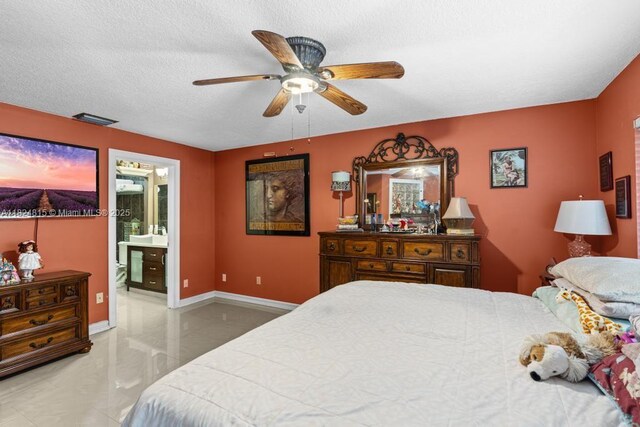 10091 SW 137th Pl, Miami, FL 33186 - bedroom with ensuite bathroom, a ceiling fan, and a textured ceiling