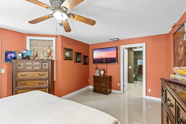 10091 SW 137th Pl, Miami, FL 33186 - bedroom featuring a textured ceiling, ensuite bathroom, and ceiling fan