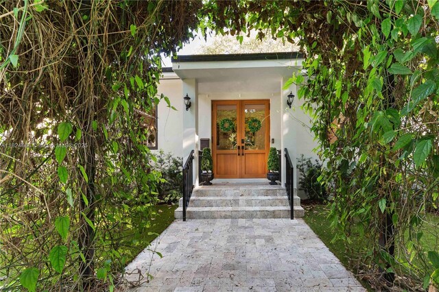 1460 Mantua Ave, Coral Gables, FL 33146 - property entrance with french doors and stucco siding