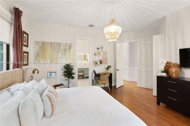 1460 Mantua Ave, Coral Gables, FL 33146 - bedroom featuring wood finished floors and ensuite bath