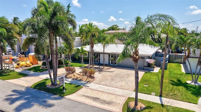 501 SE 7th Ave, Pompano Beach, FL 33060 - view of front of property with decorative driveway and a garage