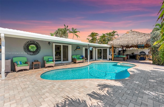 501 SE 7th Ave, Pompano Beach, FL 33060 - outdoor pool featuring an in-ground hot tub, a patio area, and outdoor lounge area