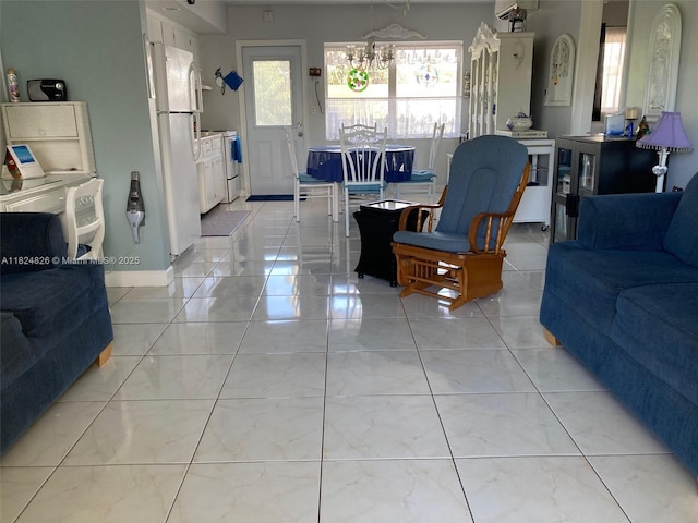 223 S Federal Hwy Unit 46, Dania Beach, FL 33004 - living area with light marble finish floors and a chandelier