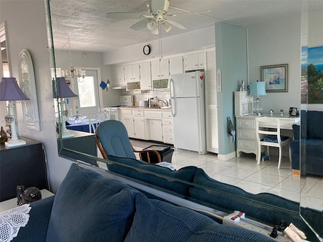 223 S Federal Hwy Unit 46, Dania Beach, FL 33004 - living area featuring light tile patterned flooring, ceiling fan, and a textured ceiling
