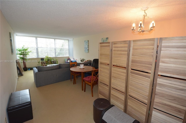 6500 Cypress Rd Unit 410, Plantation, FL 33317 - carpeted living room featuring a chandelier and a textured ceiling
