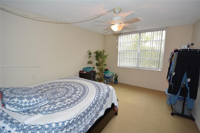 6500 Cypress Rd Unit 410, Plantation, FL 33317 - carpeted bedroom with a ceiling fan and a textured ceiling
