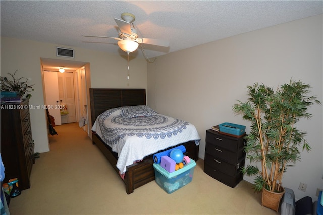 6500 Cypress Rd Unit 410, Plantation, FL 33317 - bedroom featuring light carpet, a ceiling fan, and a textured ceiling