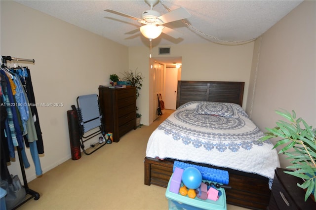 6500 Cypress Rd Unit 410, Plantation, FL 33317 - bedroom featuring light carpet, a ceiling fan, and a textured ceiling