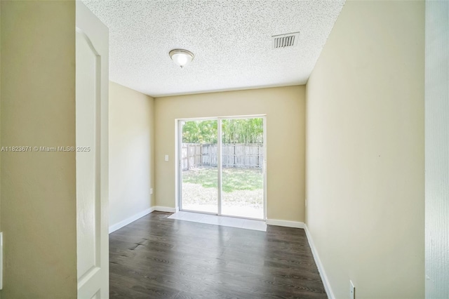 8995 SW 213th St, Cutler Bay, FL 33189 - unfurnished room featuring dark wood-style flooring and a textured ceiling