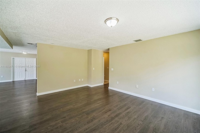 8995 SW 213th St, Cutler Bay, FL 33189 - spare room featuring dark wood-type flooring and a textured ceiling