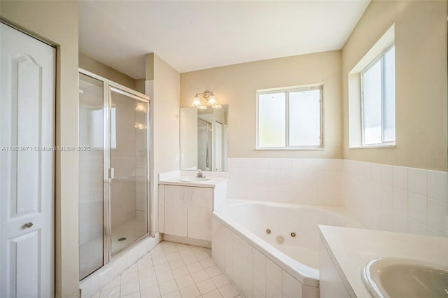 8995 SW 213th St, Cutler Bay, FL 33189 - full bathroom with two vanities, a shower stall, a whirlpool tub, and tile patterned floors