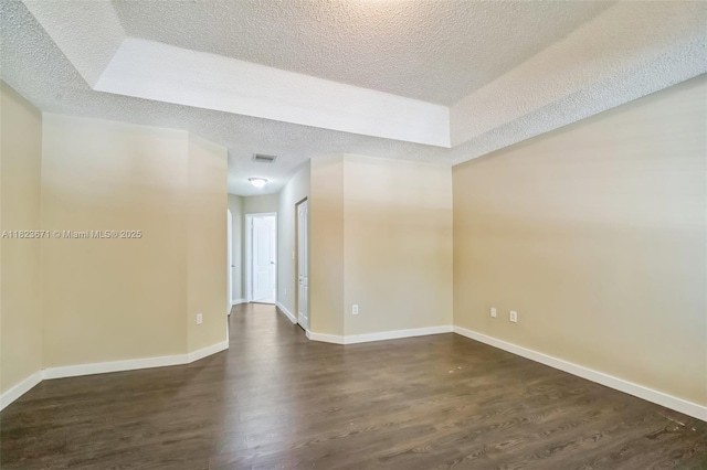 8995 SW 213th St, Cutler Bay, FL 33189 - empty room with a textured ceiling and dark wood-style floors