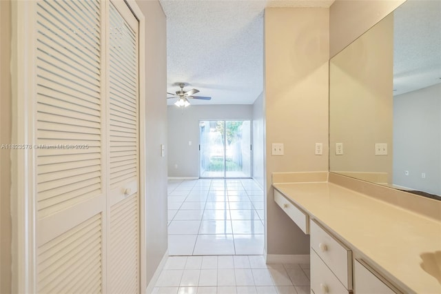 9537 SW 154th Ave, Miami, FL 33196 - bathroom featuring a textured ceiling, tile patterned floors, vanity, a ceiling fan, and a closet