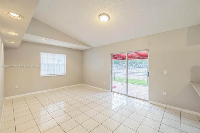 9537 SW 154th Ave, Miami, FL 33196 - unfurnished room with lofted ceiling, light tile patterned floors, a textured ceiling, and recessed lighting