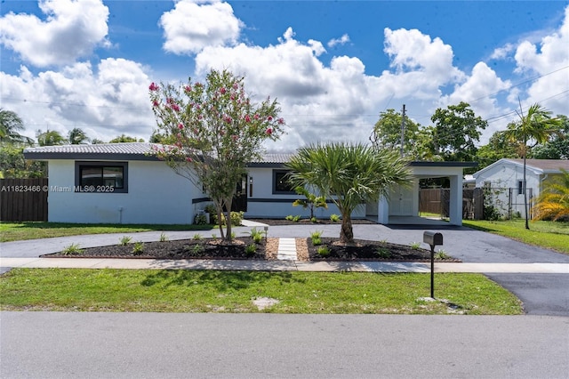 1157 SW 4th Ave, Pompano Beach, FL 33060 - single story home with curved driveway, stucco siding, and an attached carport