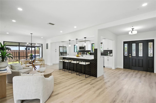 1157 SW 4th Ave, Pompano Beach, FL 33060 - living room with light wood-style flooring and recessed lighting