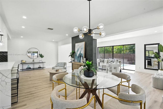 1157 SW 4th Ave, Pompano Beach, FL 33060 - dining area featuring light wood-type flooring, recessed lighting, and a chandelier