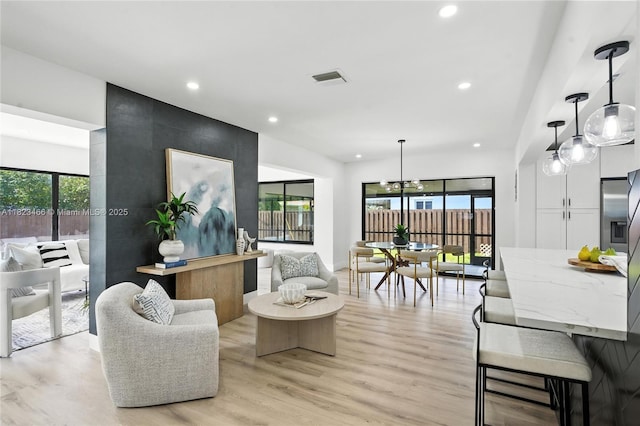1157 SW 4th Ave, Pompano Beach, FL 33060 - living room with recessed lighting, light wood-style flooring, and a chandelier
