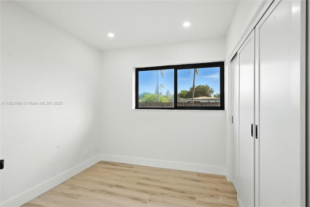 1157 SW 4th Ave, Pompano Beach, FL 33060 - unfurnished bedroom with recessed lighting, light wood-style flooring, and a closet