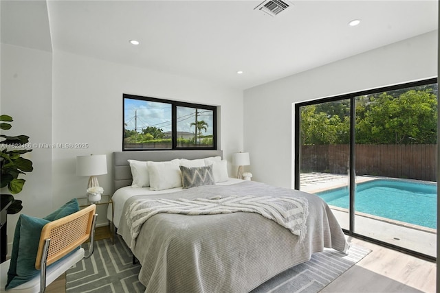 1157 SW 4th Ave, Pompano Beach, FL 33060 - bedroom featuring access to outside, wood finished floors, multiple windows, and recessed lighting
