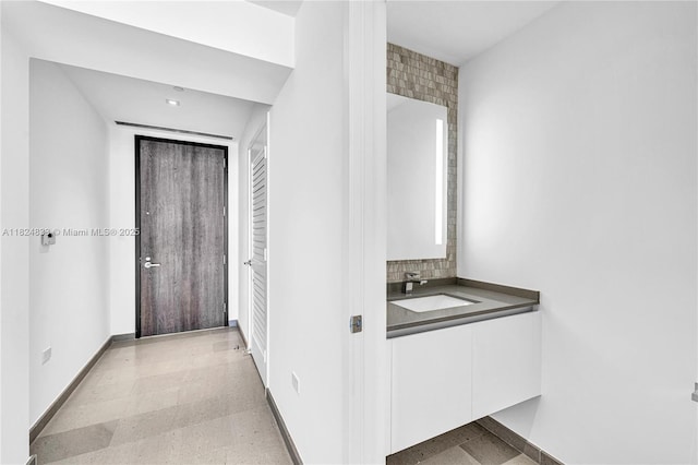 88 SW 7th St Unit 1006, Miami, FL 33130 - corridor with a sink and baseboards