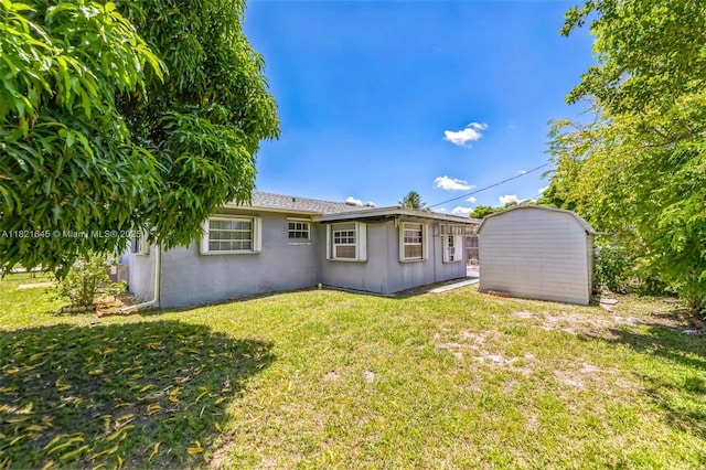 6701 NW 6th St, Margate, FL 33063 - back of house featuring a storage unit, a lawn, stucco siding, and board and batten siding