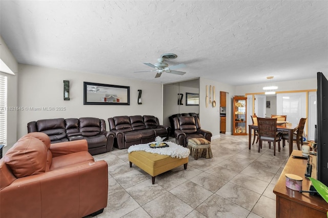 6701 NW 6th St, Margate, FL 33063 - living room with a ceiling fan, light tile patterned floors, and a textured ceiling