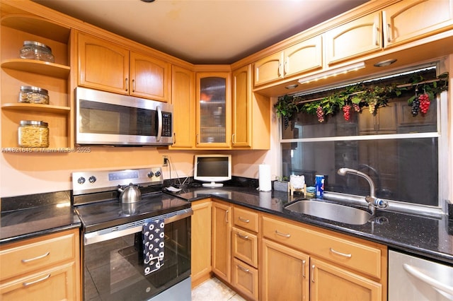 6701 NW 6th St, Margate, FL 33063 - kitchen with stainless steel appliances, open shelves, dark stone counters, glass insert cabinets, and light tile patterned floors