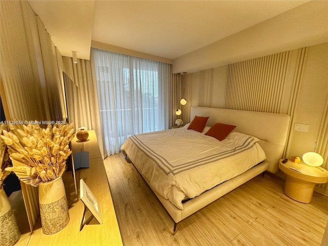 1010 SW 2nd Ave Unit 601, Miami, FL 33130 - bedroom featuring hardwood / wood-style floors and access to exterior