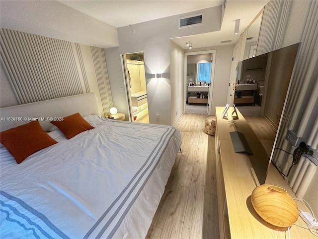 1010 SW 2nd Ave Unit 601, Miami, FL 33130 - bedroom featuring light wood-style flooring