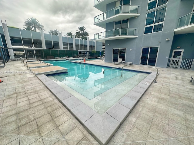 1010 SW 2nd Ave Unit 601, Miami, FL 33130 - community pool featuring a patio
