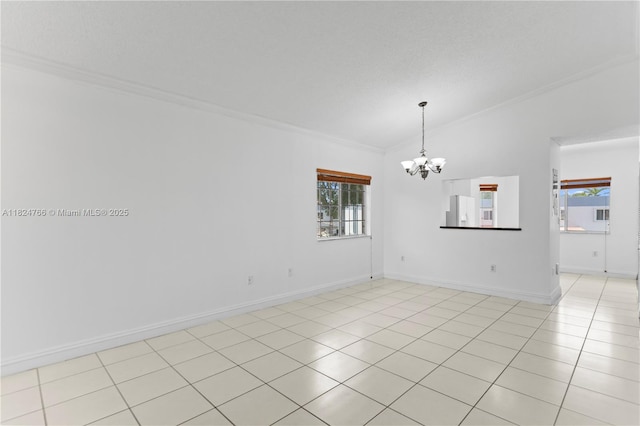6445 SW 130th Pl Unit 612, Miami, FL 33183 - spare room featuring ornamental molding, lofted ceiling, a chandelier, and light tile patterned flooring